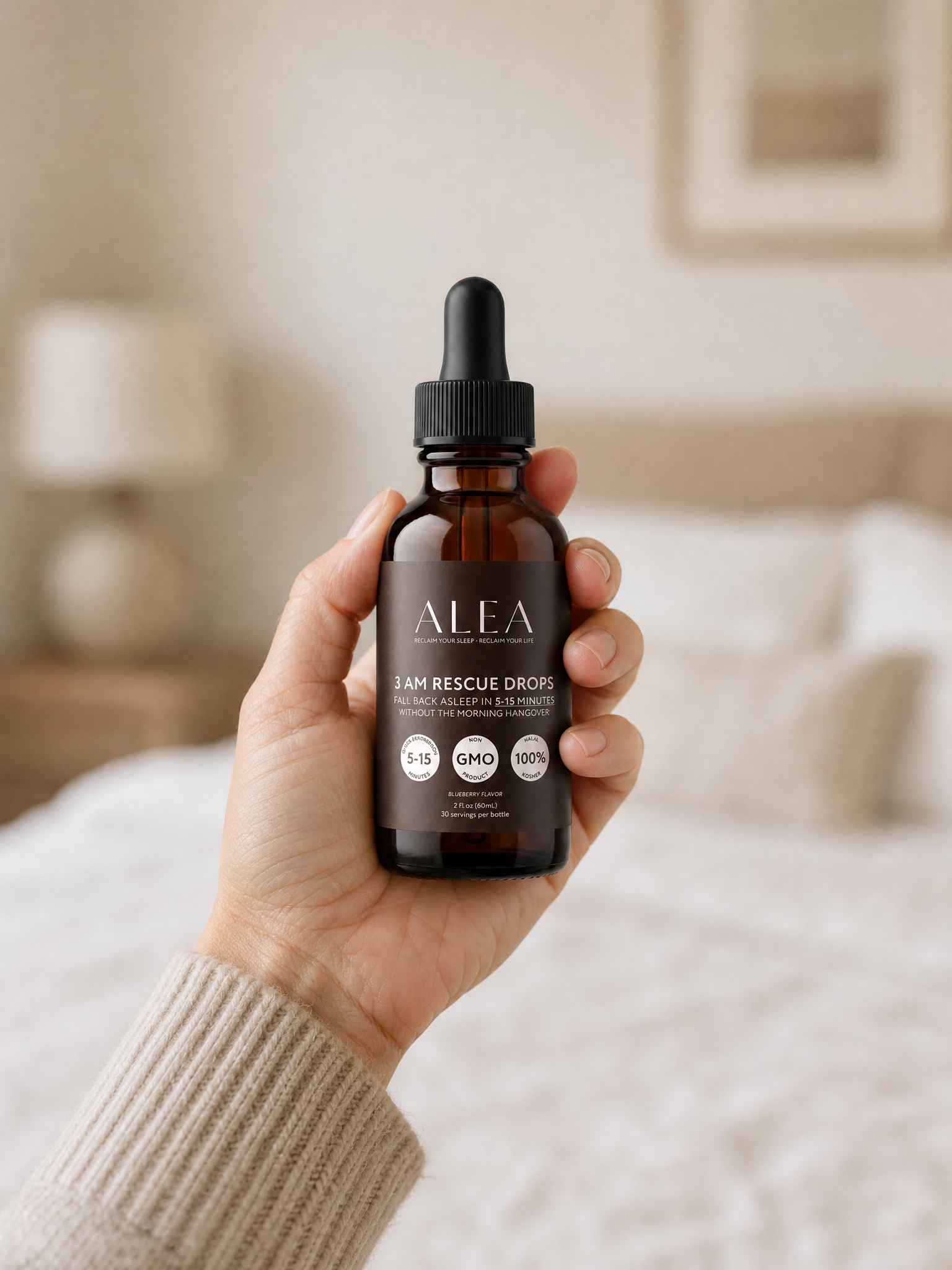 Woman's hand holding the small 60 ml ALEA Rescue Drops bottle